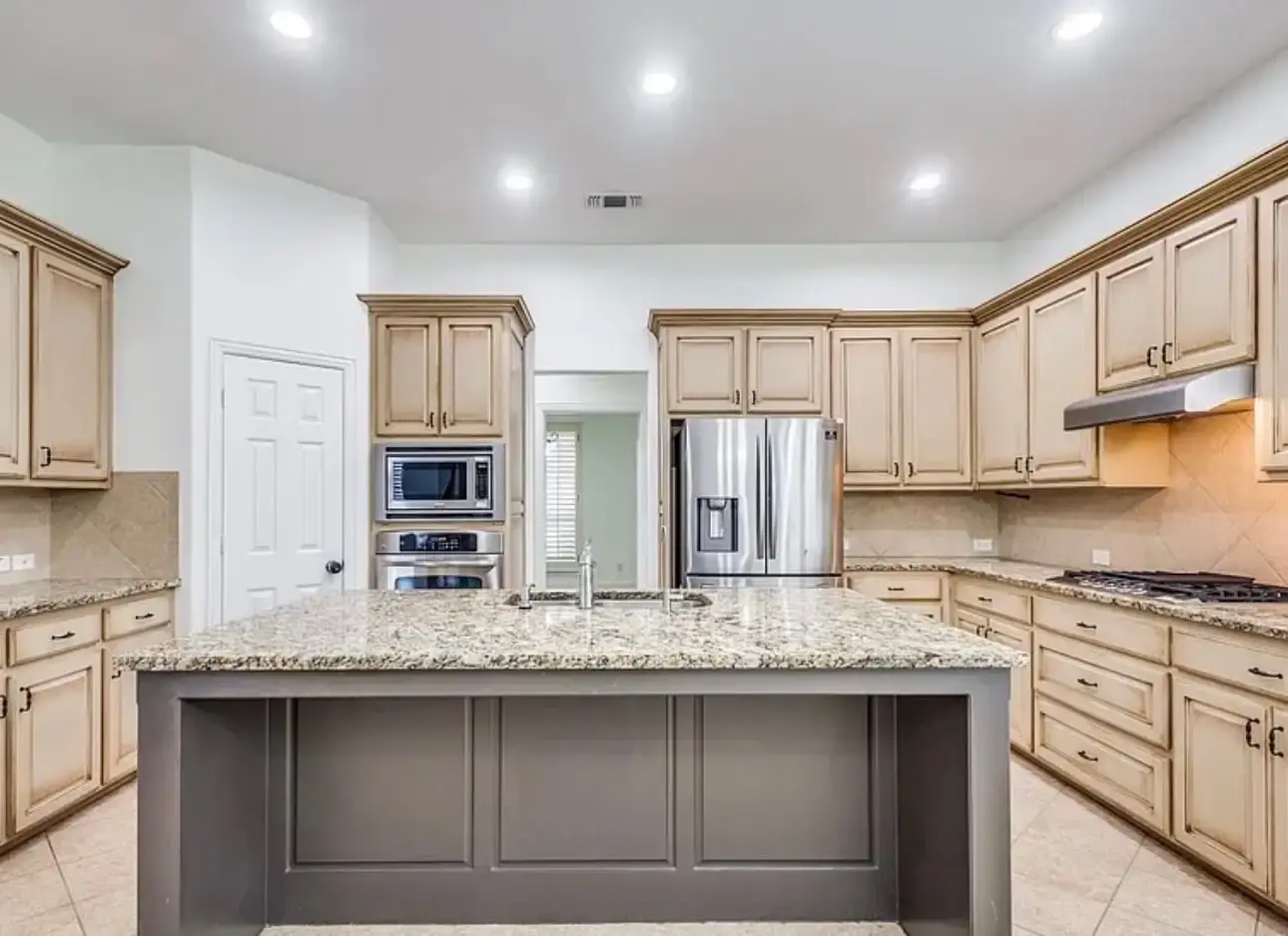Offwhite painted ceiling with grid of gray painted extruded ceiling accent pieces